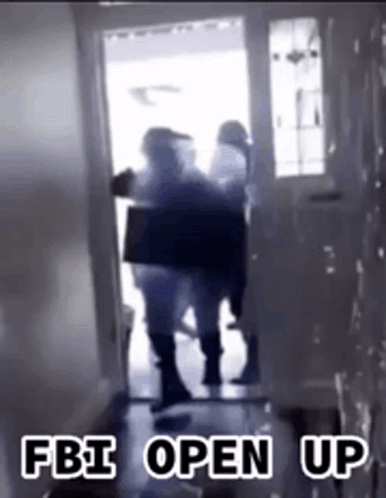 A Group Of People Are Standing In A Hallway With The Words Fbi Open Up On The Bottom GIF
