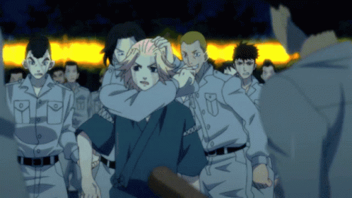 A Group Of People Are Standing In A Line And One Of Them Has A Shirt That Says ' Tokyo Ghoul ' On It GIF