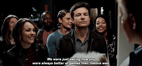 A Group Of People Are Standing In A Line And One Of Them Is Talking To Another Person . GIF