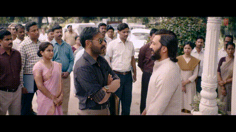 A Group Of People Are Standing In A Line And One Of Them Is Wearing A Pink Saree GIF