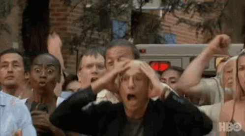 A Group Of People Are Standing In A Line With Their Hands On Their Head . GIF