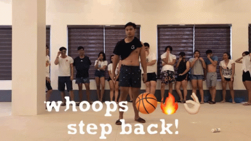 A Group Of People Are Standing In A Room With The Words Whoops Step Back GIF