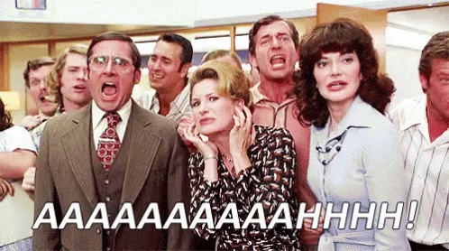 A Group Of People Are Standing In A Room With Their Mouths Open And One Of Them Is Screaming . GIF
