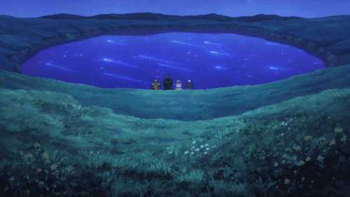 A Group Of People Are Standing In Front Of A Blue Lake GIF