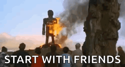 A Group Of People Are Standing In Front Of A Burning Statue Of A Man . GIF