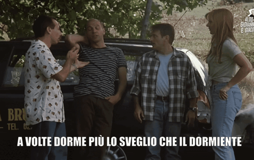 A Group Of People Are Standing In Front Of A Car That Says Brio GIF