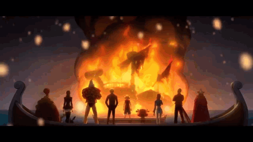 A Group Of People Are Standing In Front Of A Fire . GIF