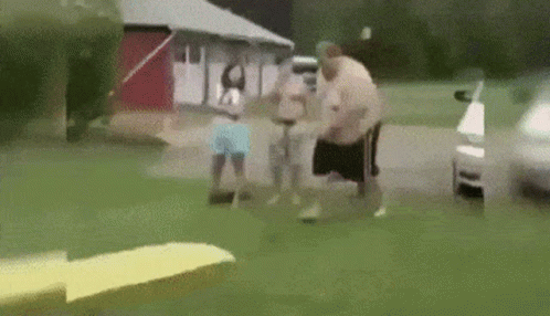 A Group Of People Are Standing In Front Of A House And A Car . GIF