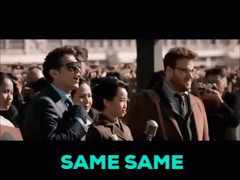 A Group Of People Are Standing In Front Of A Microphone And The Words Same Same Are On The Screen GIF