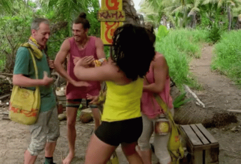 A Group Of People Are Standing In Front Of A Sign That Says Kama GIF