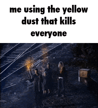 A Group Of People Are Standing In Front Of Train Tracks And Using The Yellow Dust That Kills Everyone . GIF
