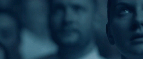 A Group Of People Are Standing Next To Each Other And Looking Up At Something . GIF
