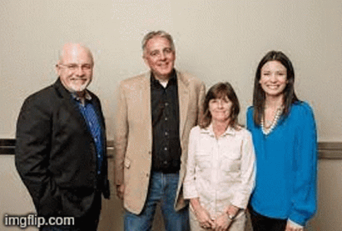 A Group Of People Are Standing Next To Each Other And Smiling For The Camera . GIF