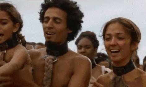 A Group Of People Are Standing Next To Each Other In A Crowd Without Shirts On . GIF