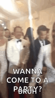 A Group Of People Are Standing Next To Each Other In A Room And One Of Them Is Holding A Gun . GIF