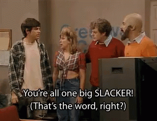 A Group Of People Are Standing Next To Each Other In Front Of A Television And Talking . GIF