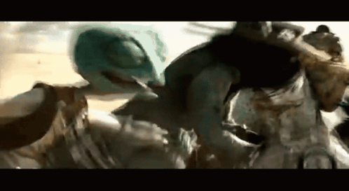 A Group Of People Are Standing Next To Each Other On A Beach . GIF