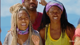 A Group Of People Are Standing Next To Each Other On A Beach And Smiling . GIF