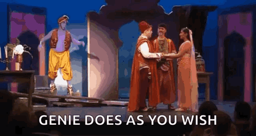 A Group Of People Are Standing On A Stage With The Words `` Genie Does As You Wish '' . GIF