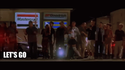 A Group Of People Are Standing Outside Of A Mastercraft Store GIF