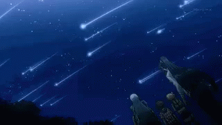 A Group Of People Are Standing Under A Starry Sky With Shooting Stars . GIF