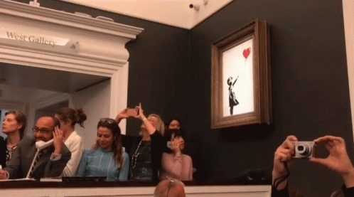 A Group Of People Are Taking Pictures Of A Painting At The West Gallery GIF
