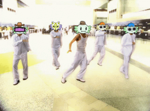 A Group Of People Are Walking Down A Hallway With Masks On Their Faces Including One That Says ' Hello ' GIF