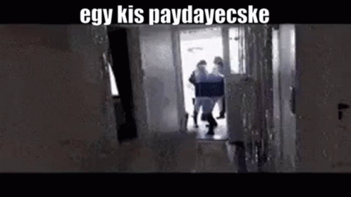 A Group Of People Are Walking Down A Hallway With The Words `` Egy Kis Paydayecske '' Written On The Bottom . GIF