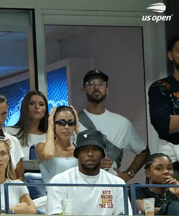 A Group Of People Are Watching A Tennis Match Sponsored By Us Open . GIF