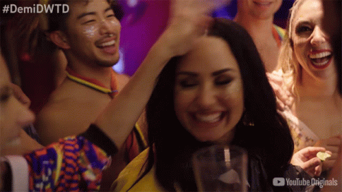 A Group Of People At A Party With The Hashtag #Demidwtd GIF