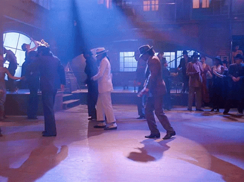 Group Dancing In Dark Room With Blue Lights GIF