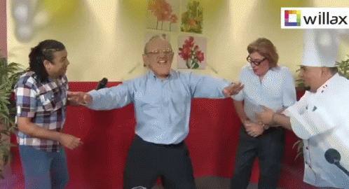 A Group Of People Dancing In Front Of A Willax Sign GIF