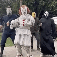 A Group Of People Dressed Up In Halloween Costumes Are Dancing Together . GIF