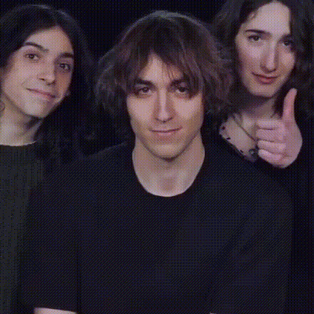A Group Of People Giving A Thumbs Up Sign GIF