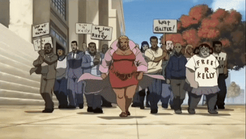 A Group Of People Holding Signs That Say Free R Kelly GIF
