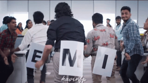 A Group Of People Holding Signs With The Letters Emi On Them GIF