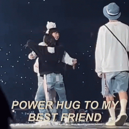 A Group Of People Hugging Each Other On A Stage With The Words `` Power Hug To My Best Friend '' Written Above Them . GIF