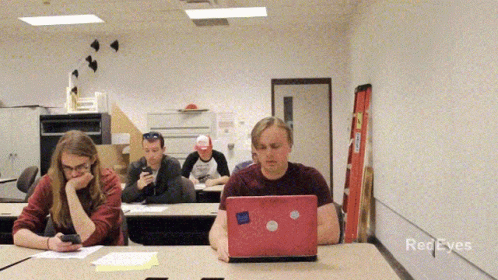 A Group Of People In A Classroom With Red Eyes Written On The Bottom Of The Screen GIF
