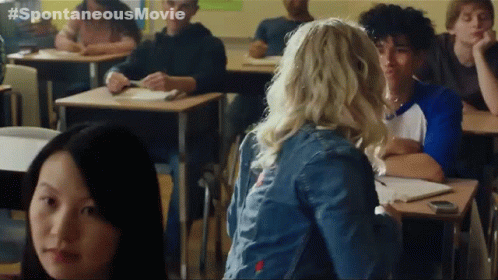 a group of people in a classroom with #spontaneousmovie written on the bottom right