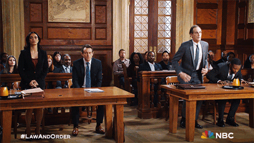 A Group Of People In A Courtroom With Nbc Written On The Bottom Right GIF