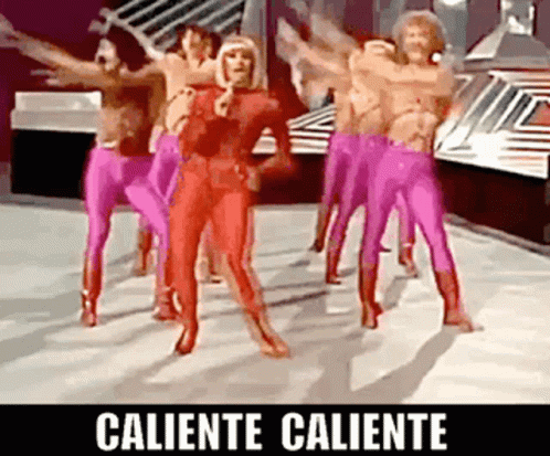 A Group Of People In Pink Pants Are Dancing With The Words Caliente Caliente On The Bottom GIF