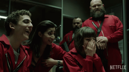 A Group Of People In Red Jumpsuits With Netflix Written On The Bottom Right GIF