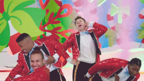A Group Of People In Red Sequined Suits Are Dancing GIF