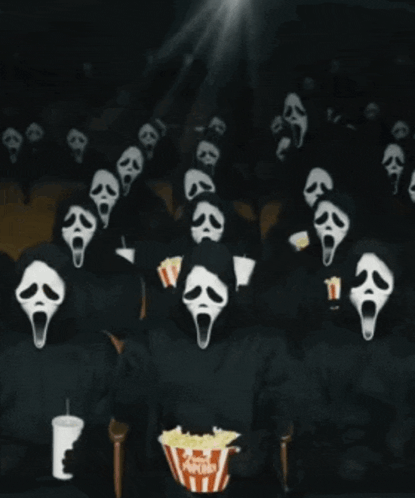 a group of people in scream masks watching a movie