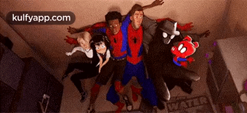 A Group Of People In Spiderman Costumes Are Standing Next To Each Other . GIF