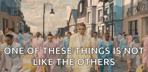 A Group Of People In Suits Are Walking Down A Street With The Words One Of These Things Is Not Like The Others GIF