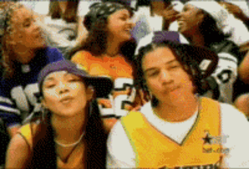 A Group Of People Including A Man Wearing A Jersey With The Number 5 On It GIF