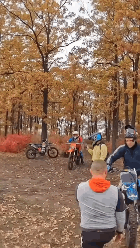 A Group Of People On Dirt Bikes In The Woods GIF