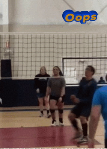 A Group Of People Playing Volleyball With The Word Oops In The Corner GIF