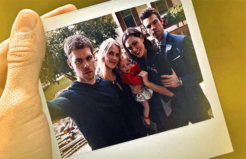 A Group Of People Posing For A Picture Together GIF